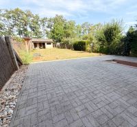 The yard of a family house on Vajka nad Žitavou street in the town of Lúčnica nad Žitavou with a lawn.