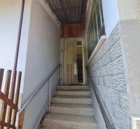Stairs leading to the entrance of a family house in Dolné Otrokovce, covered by a roof.