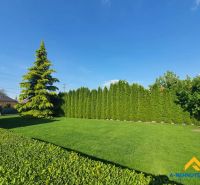 A peaceful garden surrounded by trees in Dolný Štál, suitable for residential land.