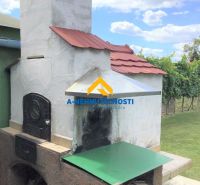 The exterior of a family house in Veľký Meder with a traditional outdoor oven.