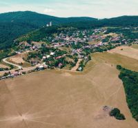 Aerial view of Podhradie with family houses and nature. Residential plots.