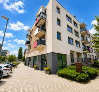 Commercial premises on Okružná Street in Stupava, a modern building with greenery and parking.