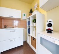 Kitchen corner in commercial premises with a kettle and a coffee maker.