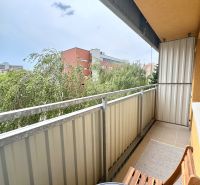 The balcony of a 1-room apartment on Sekurisova Street in Bratislava - Dúbravka with a view of greenery.