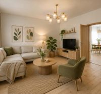 Living room in a family house with a wooden decor floor, a sofa, and a television.