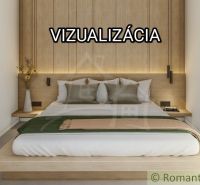 A bedroom in a family house with wooden decor and simple furnishings.