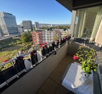 A balcony with plants and a view of Bosákova Street, Bratislava - Petržalka.