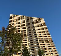 A high-rise building on Bosákova Street in Bratislava - Petržalka, surrounded by greenery.