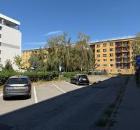 Apartment buildings with greenery and parking on Stromová Street in Košice, Old Town.