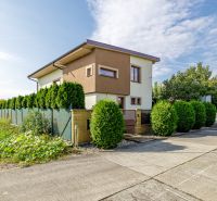 A family house on Majerská Street in Nová Dedinka with a landscaped garden and green shrubs.