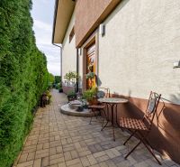 Family house on Majerská Street in Nová Dedinka with an outdoor seating area and a hedge.