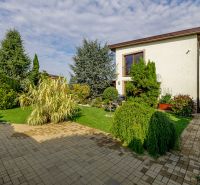 A family house on Majerská Street in Nová Dedinka with a landscaped garden and paving.