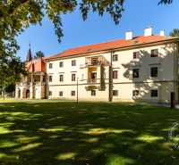 A historic building surrounded by greenery on Vincenta Šikulu, Stupava, offering peaceful living.