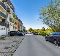 Vincent Šikula Street in Stupava, parking lot and multi-story buildings near a 2-room apartment.