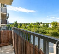 The balcony of a 2-room apartment in Stupava on Vincent Šikula Street with a view of greenery.