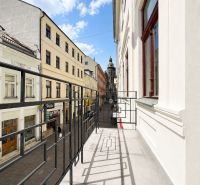 Balcony with a view of Mlynská Street, Košice - Staré Mesto district, in front of the offices.