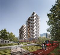 New building with balconies, cyclist and tram on Mlynské Nivy in Bratislava-Ružinov.