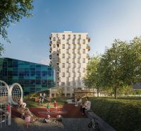 Apartment building with glass panels and a children's playground on Mlynské Nivy in Bratislava - Ružinov.