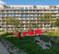 Residential complex with a children's playground and benches in Bratislava - New Ružinov on Bajkalská.