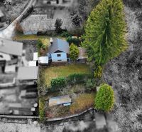 Aerial view of a cottage with a garden in Žilina, surrounded by trees and nature.