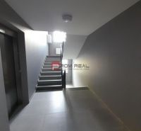 Hallway with stairs and elevator in a 2-room apartment.