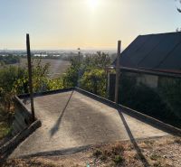 The view from the cottage in the town of Banka of the surrounding landscape at sunset.