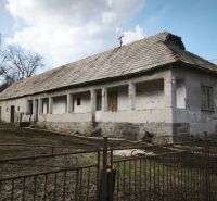 A family house on Tučekova Street in Veľký Krtíš with an old roof and a garden.