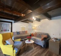 Living room in a family house with a wooden decor floor and comfortable furniture.
