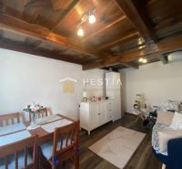 Living room in a family house with furniture and flooring in wood decor.