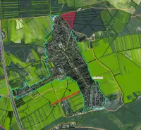 Aerial view of agricultural and forest land in Závod with paved roads.
