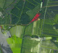 Aerial view of agricultural and forest land around Závod with marked parcels.
