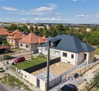 A family house on Trnavská Street in Nitra surrounded by gardens and neighboring houses.