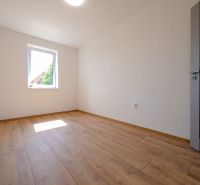 A room with a wooden floor decor in a family house without furniture.