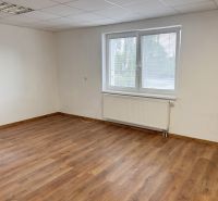 An empty room with a wooden decor floor, a window, and white walls in a family house.
