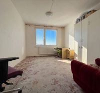 A room with a carpet and furniture in a 2-room apartment, bright interior.