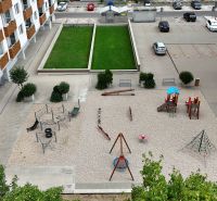 The courtyard by the 3-room apartment on Nobelova Street in Bratislava - Nové Mesto with a children's playground.