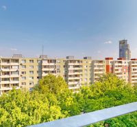View of apartment buildings surrounded by greenery on Jégeho Street in Bratislava - Ružinov.