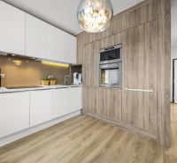 A kitchen in a 2-room apartment, white cabinets, wooden decor flooring, built-in appliances.