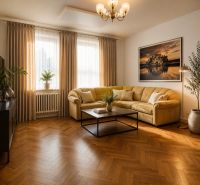 Living room in a family house with a comfortable sofa and a wooden decor floor.