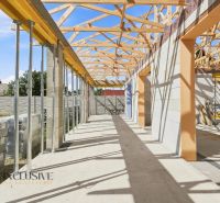 An unfinished family house in Marcelová with exposed roof structures and support columns.