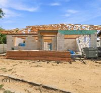 Construction of a family house in Marcelová with a wooden roof structure.