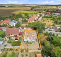A family house under construction in Marcelová, surrounded by gardens and nature.
