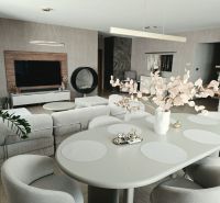 Bright living room in a 4-room apartment with decorative elements and wood-patterned flooring.