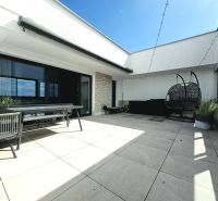 Terrace of a 4-room apartment with outdoor seating and a swing, Antolská, Bratislava - Petržalka.