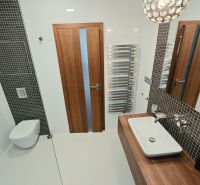 Bathroom with a wall-hung toilet, sink, and radiator in a 4-room apartment.