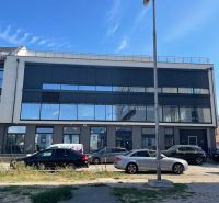 Commercial premises at Komenského 2A 2B in Levice with modern glass surfaces.