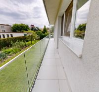 A balcony with glass railings in Petržalka on Kremnická Street, at a three-room apartment.