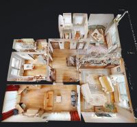 Floor plan of a 3-room apartment with furnishings and flooring with a wood decor.