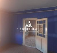 Blue room in a family house with connecting doors and a wooden decor floor.