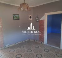 A room with a tiled floor pattern in a family house.